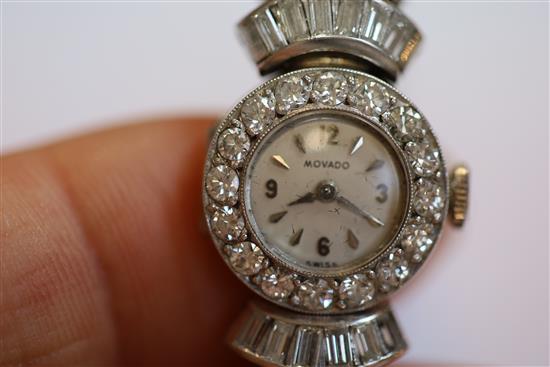 A ladys 1960s Art Deco style platinum and diamond set Movado manual wind cocktail watch, 16.5cm.